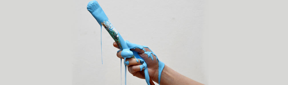 hand with paint running down
