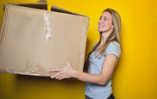 woman moving boxes